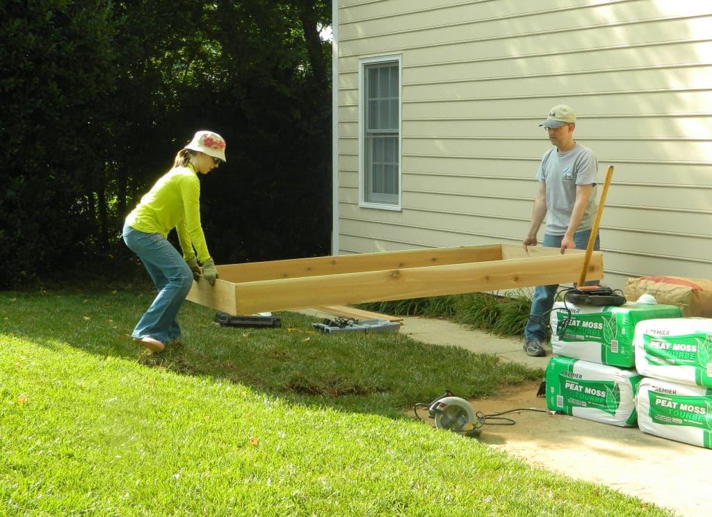 Want to make your own DIY Raised Garden Bed? This step-by-step tutorial will help get your garden up and growing in no time!