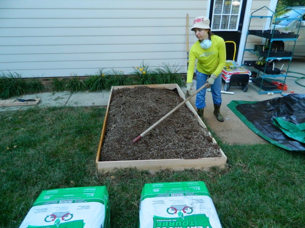 Want to make your own DIY Raised Garden Bed? This step-by-step tutorial will help get your garden up and growing in no time!