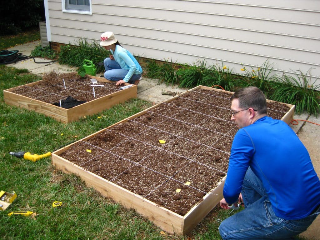 Want to make your own DIY Raised Garden Bed? This step-by-step tutorial will help get your garden up and growing in no time!