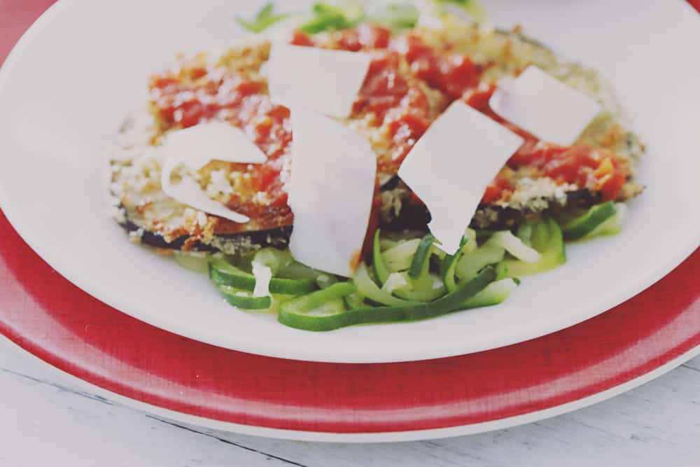 A simple and healthy twist on Eggplant Parmesan with zucchini noodles in place of regular noodles. Easy to make and delicious to eat!