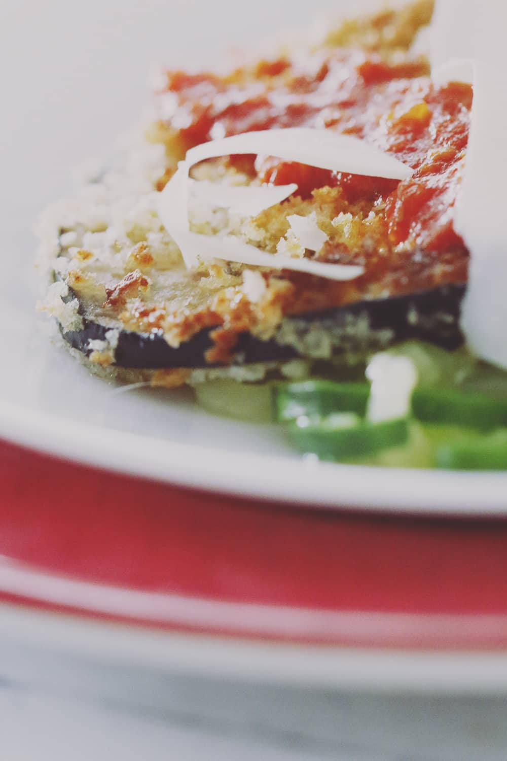 A simple and healthy twist on Eggplant Parmesan with zucchini noodles in place of regular noodles. Easy to make and delicious to eat!