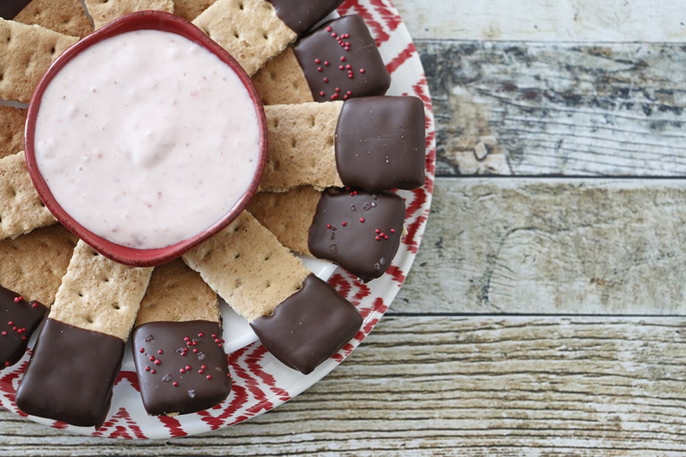 This strawberry fruit dip recipe is only three ingredients and tastes delicious with fruit, chocolate covered anything, and SO much more!