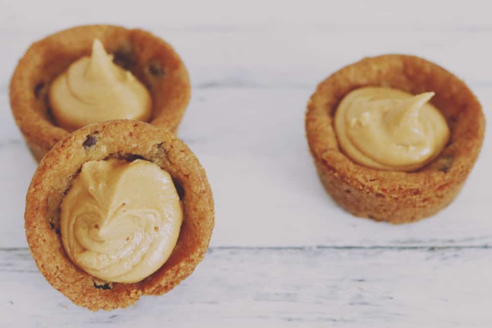 What could be better than peanut butter chocolate chip pies? Mini peanut butter chocolate chip pies! These little morsels are SUPER easy + delicious, too!