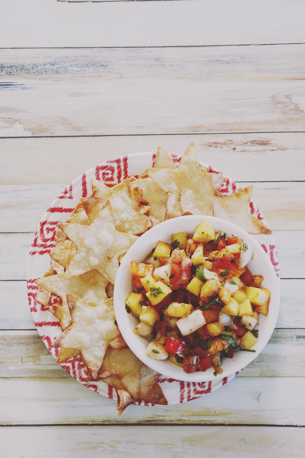 Freshen up your Summer meals with this fresh fruit peach mango salsa. It's sweet with just a hint of spice - perfect for your backyard parties!