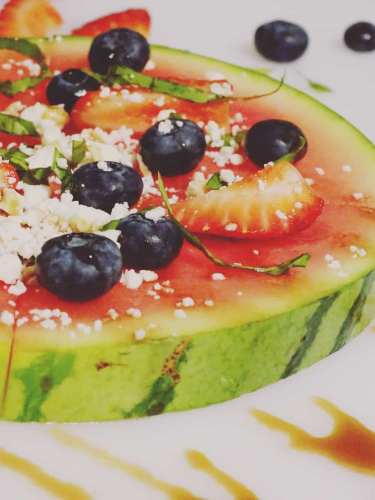 This refreshing watermelon fruit pizza is perfect for a lighter meal on a hot day. With watermelon as the base, you'll skip the extra calories, too!