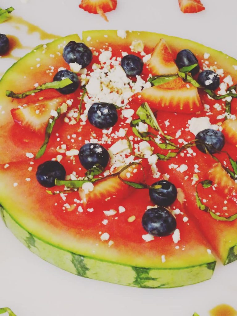 This refreshing watermelon fruit pizza is perfect for a lighter meal on a hot day. With watermelon as the base, you'll skip the extra calories, too!