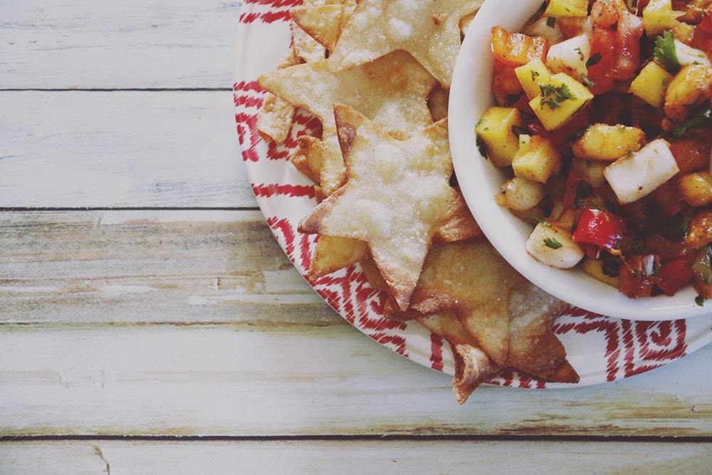 Freshen up your Summer meals with this fresh fruit peach mango salsa. It's sweet with just a hint of spice - perfect for your backyard parties!