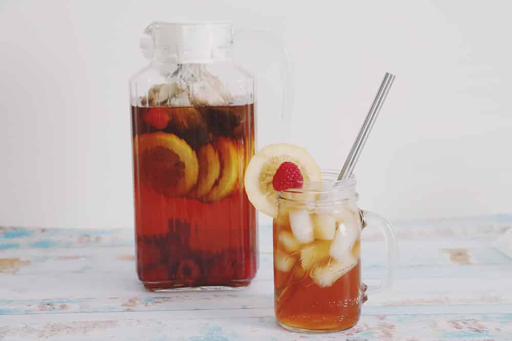 Cool off this Summer with this refreshing raspberry lemon sun tea recipe! It's a fun and fruity twist on your traditional sun tea!