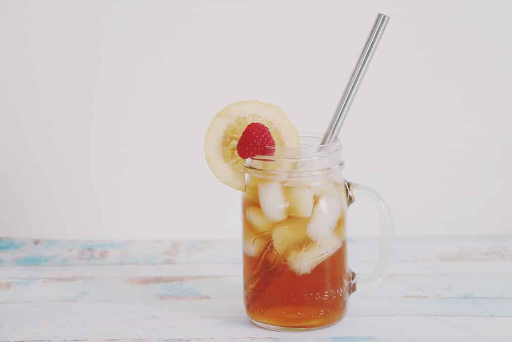 Cool off this Summer with this refreshing raspberry lemon sun tea recipe! It's a fun and fruity twist on your traditional sun tea!