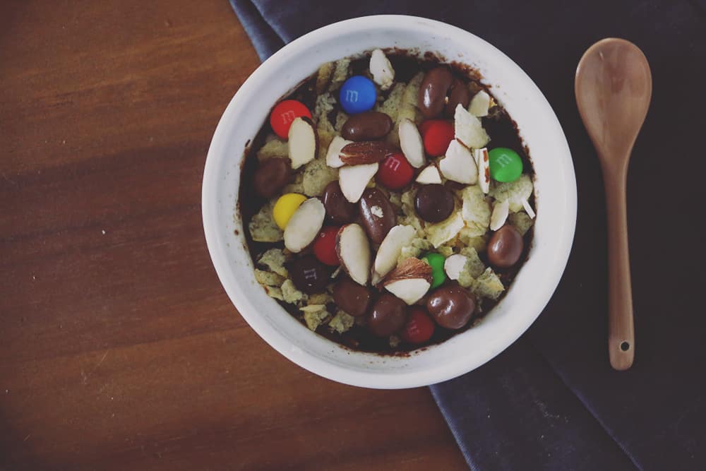 Craving something sweet and salty? This 5 minute single serve junk food mug brownie is the perfect indulgent treat for you to enjoy!