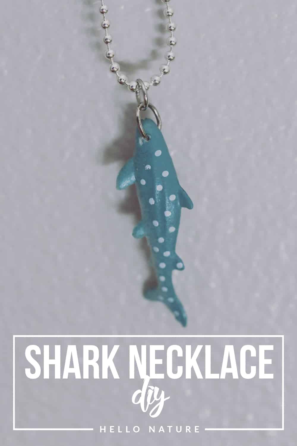 Celebrate shark week and shark awareness day with this fun and easy shark necklace DIY! You'll be ready to share your love for the ocean in no time!