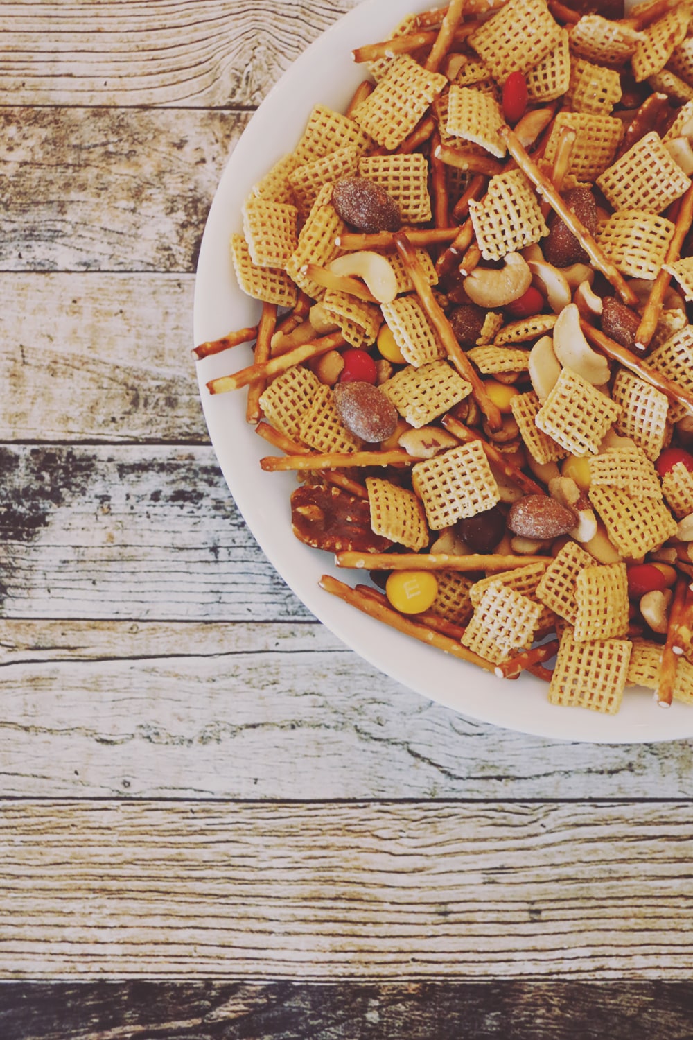 This Autumn Harvest Snack Mix Recipe is a must-have for your holiday get-togethers. With all the Fall flavors, it's sure to be a huge hit with the family!