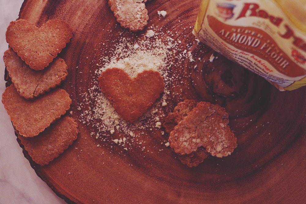 Need a gift for your furry friend? Make these deliciously easy Peanut Butter Almond Dog Biscuits! You'll never need store bought treats again!