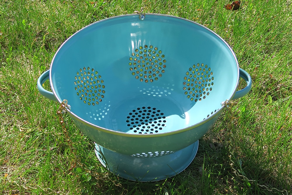 Container gardening just got more fun! With just a few supplies, you can turn a simple kitchen utensil into a unique DIY Hanging Colander Planter.