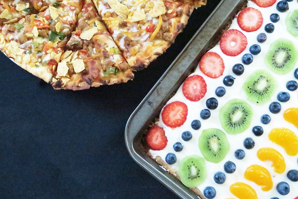 This Sugar Cookie Fruit Pizza recipe is a must-make for pizza night! It'll feed a crowd and it's super easy. This is a dessert you won't want to miss!