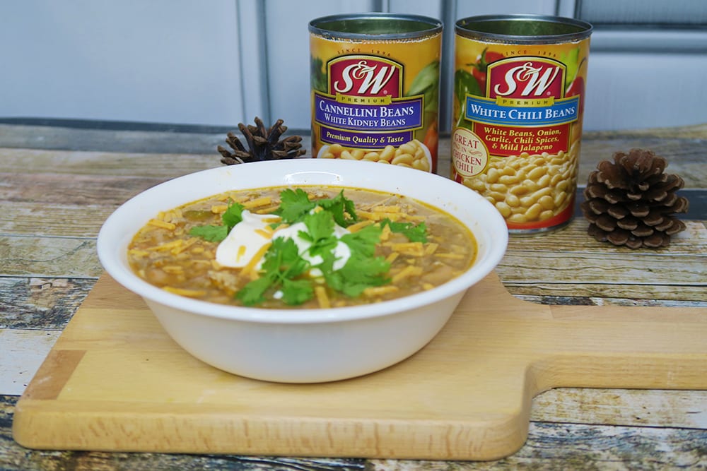 Need a hearty and healthy dish for the colder months? This Slow Cooker White Bean Turkey Chili recipe is super easy and ready in less than three hours!