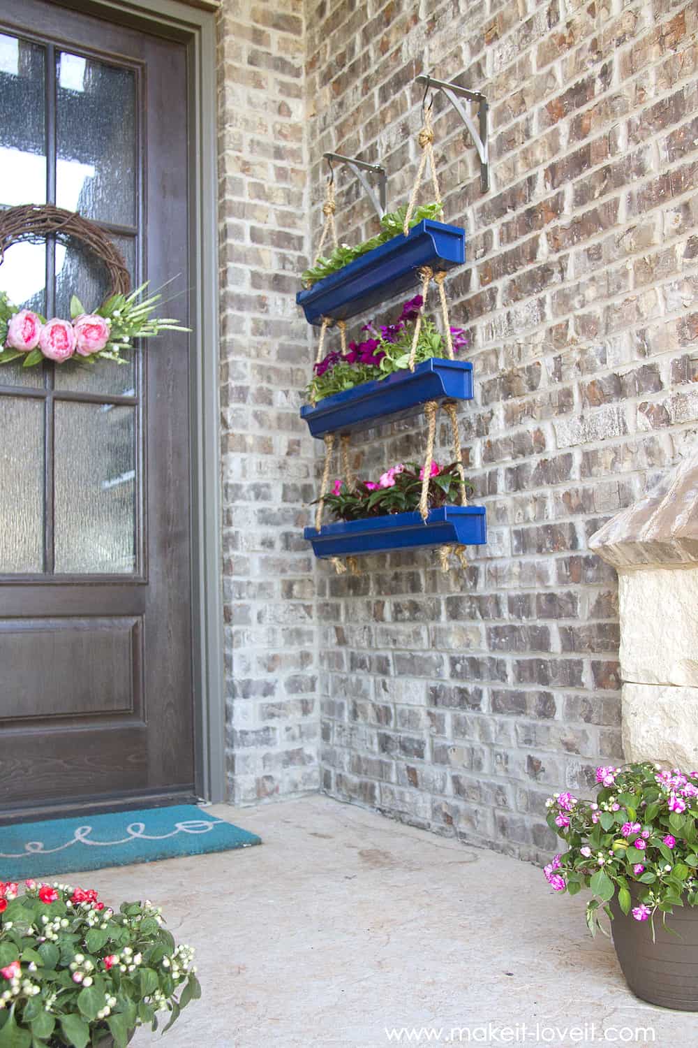 Triple stacked hanging recycled gutter planter. 