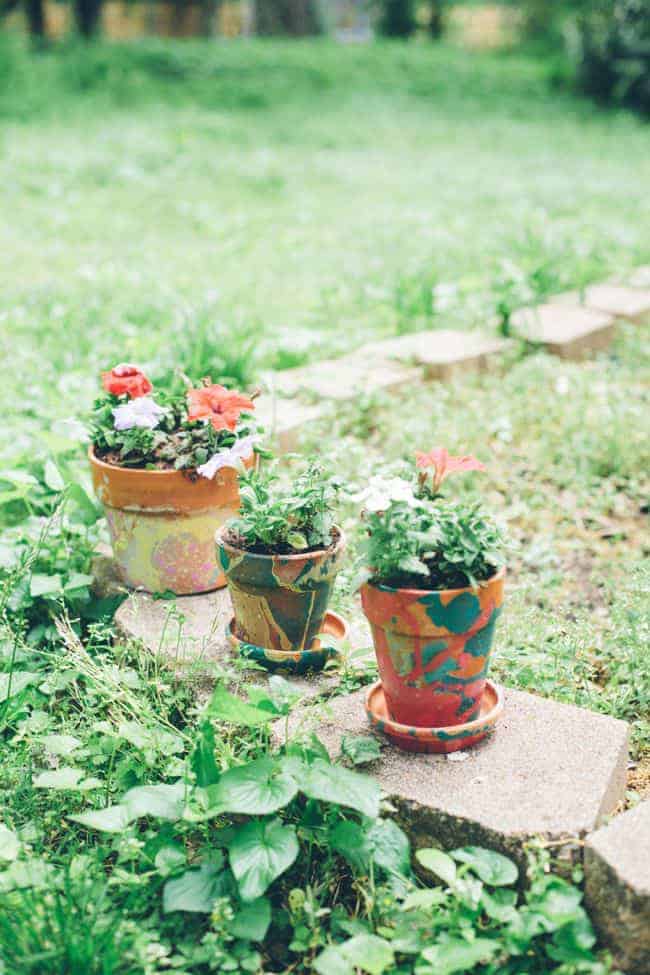 Nail polish painted terracotta pot planters.