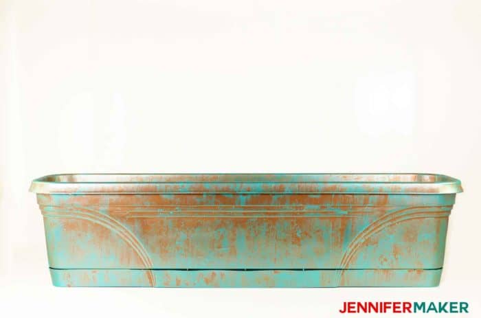 Plastic trough planter painted in copper patina.