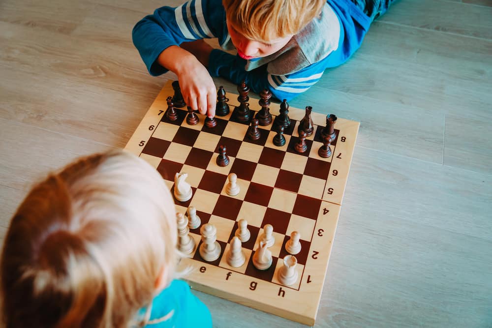 two kids playing chess