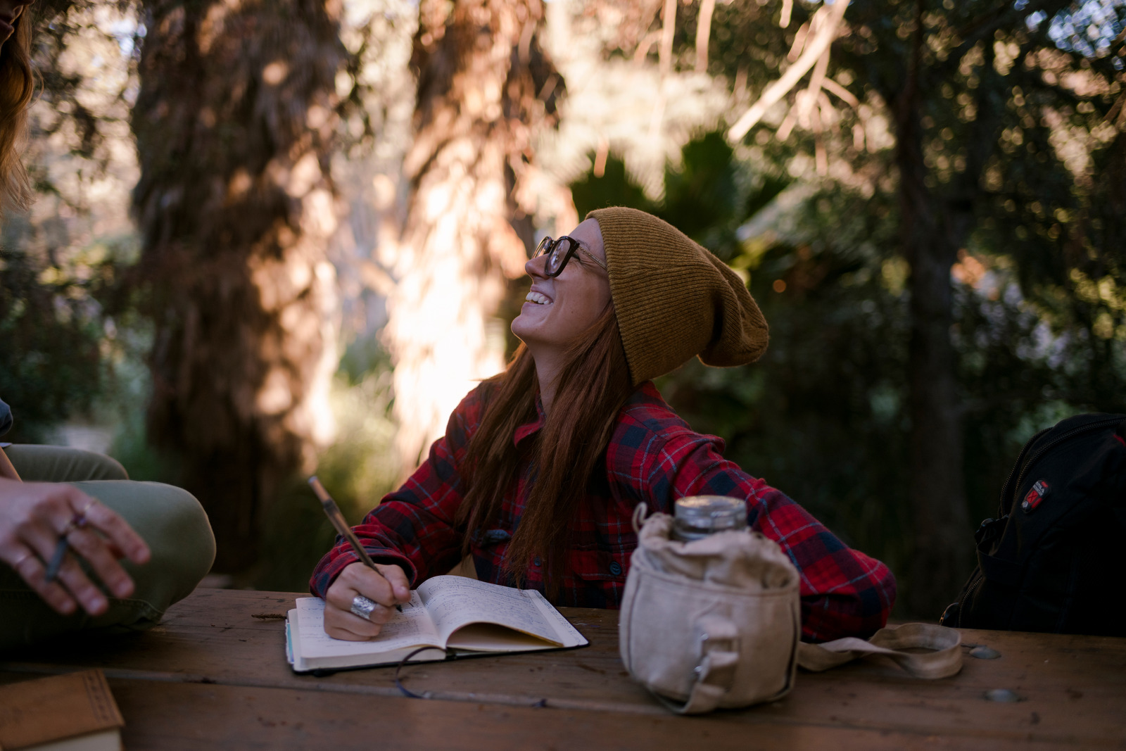Woman journaling while camping
