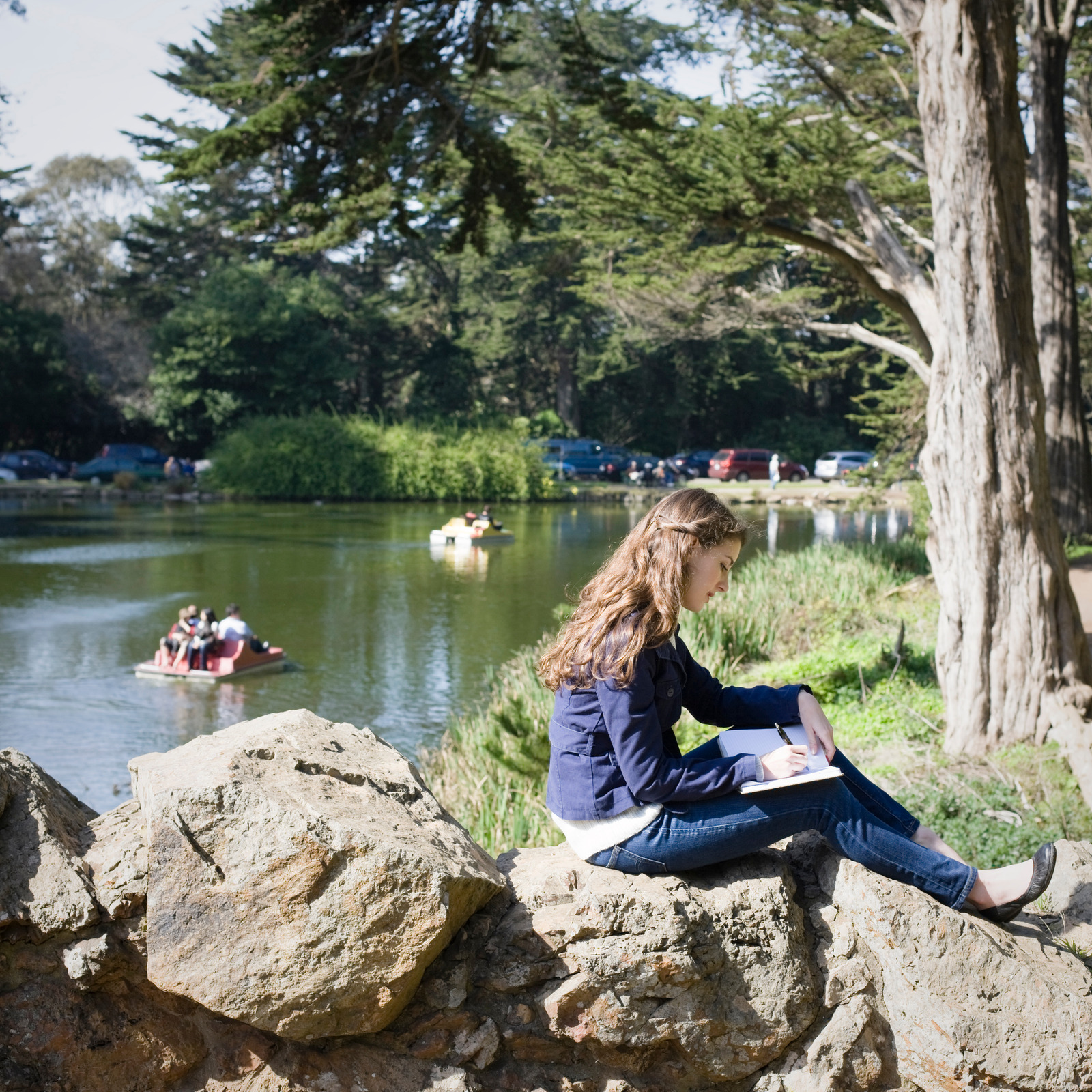 Girl writing in nature